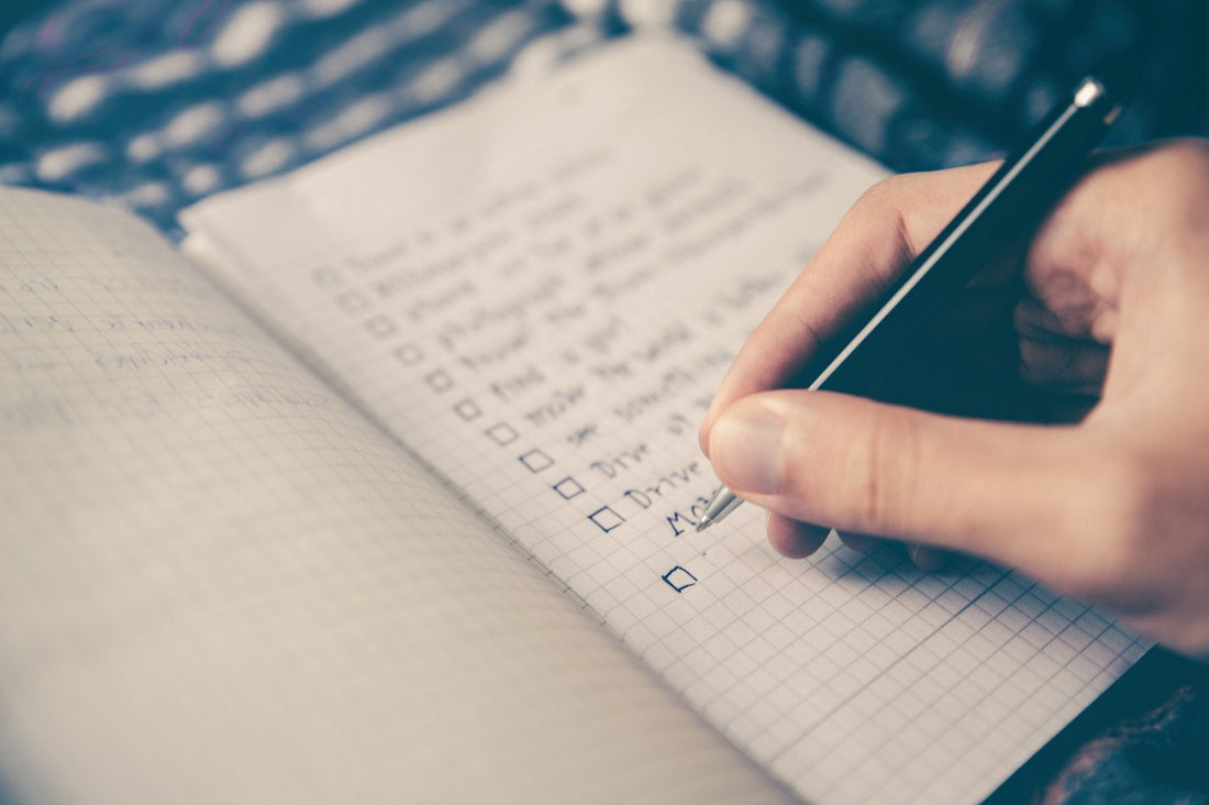 End of life checklist being written on a notepad
