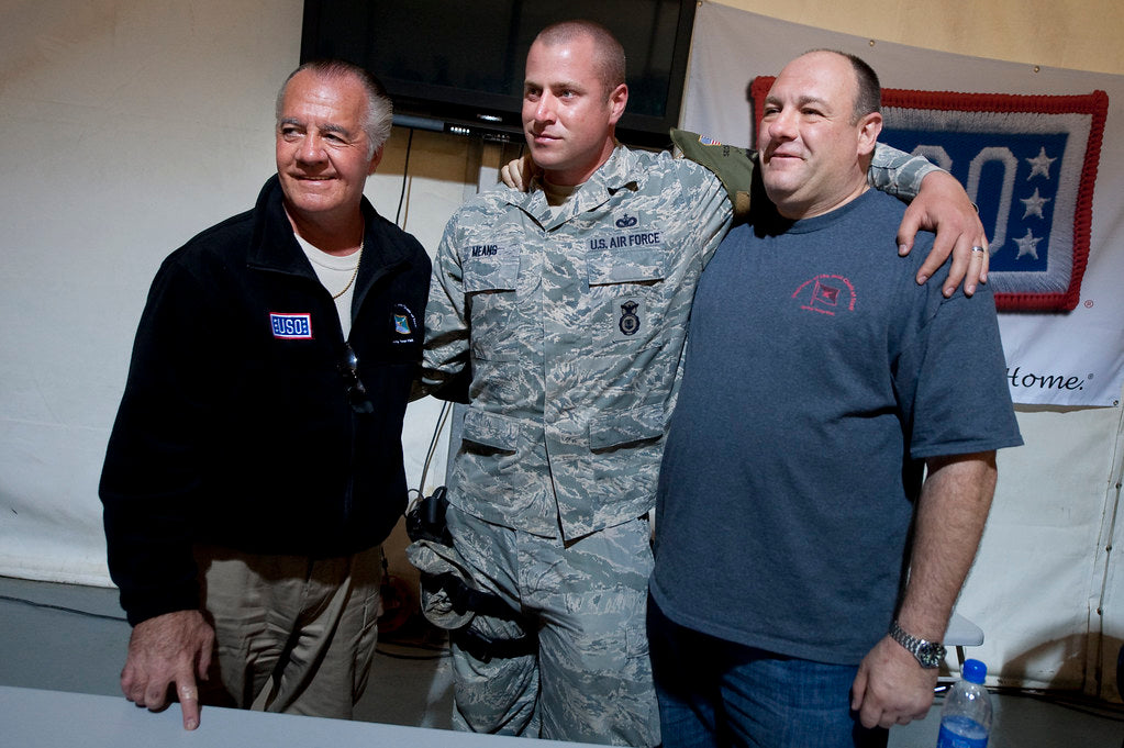 Tony Sirico and James Gandolfini pose with a US Air Force service member during a USO tour in Kuwait in March 2010
